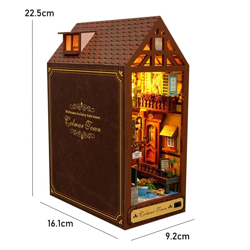 DIY book nook kit for adults – Victorian European street scene with warm amber glow and flower balconies