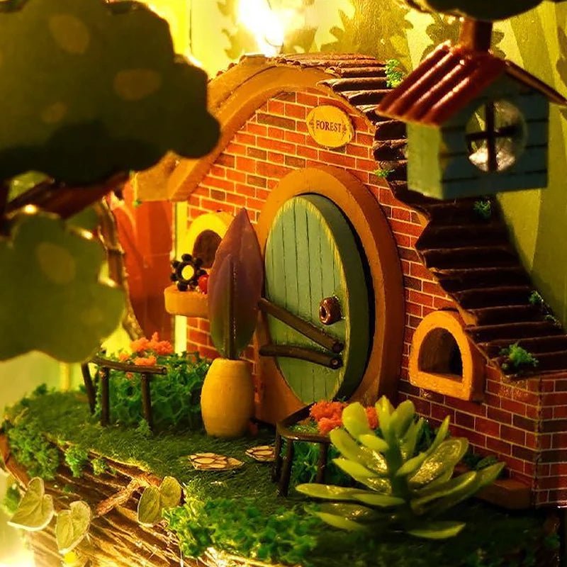Firefly Forest book nook kit detail – hobbit cottage, giant mushrooms and warm golden firefly LED lights