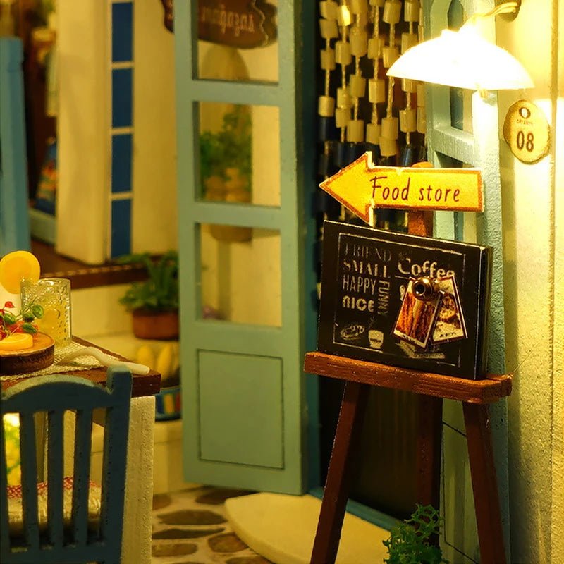 Greek Island book nook kit glowing at night – Santorini miniature shelf insert with warm LED lights