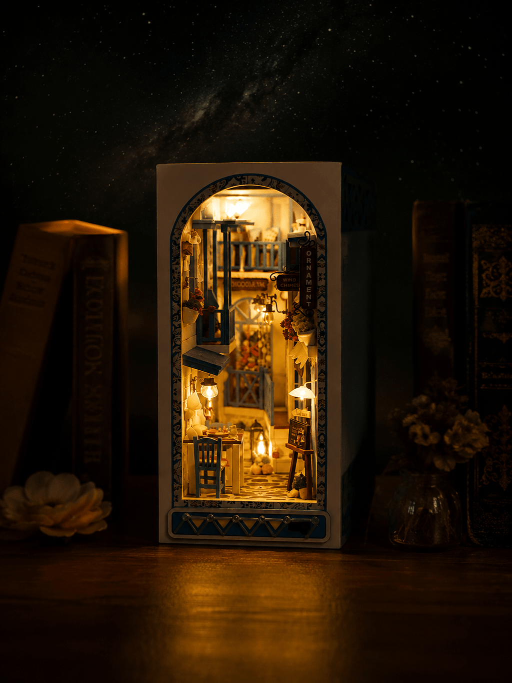 Greek island book nook kit detail – blue balconies, café terrace and warm ambient LED lighting